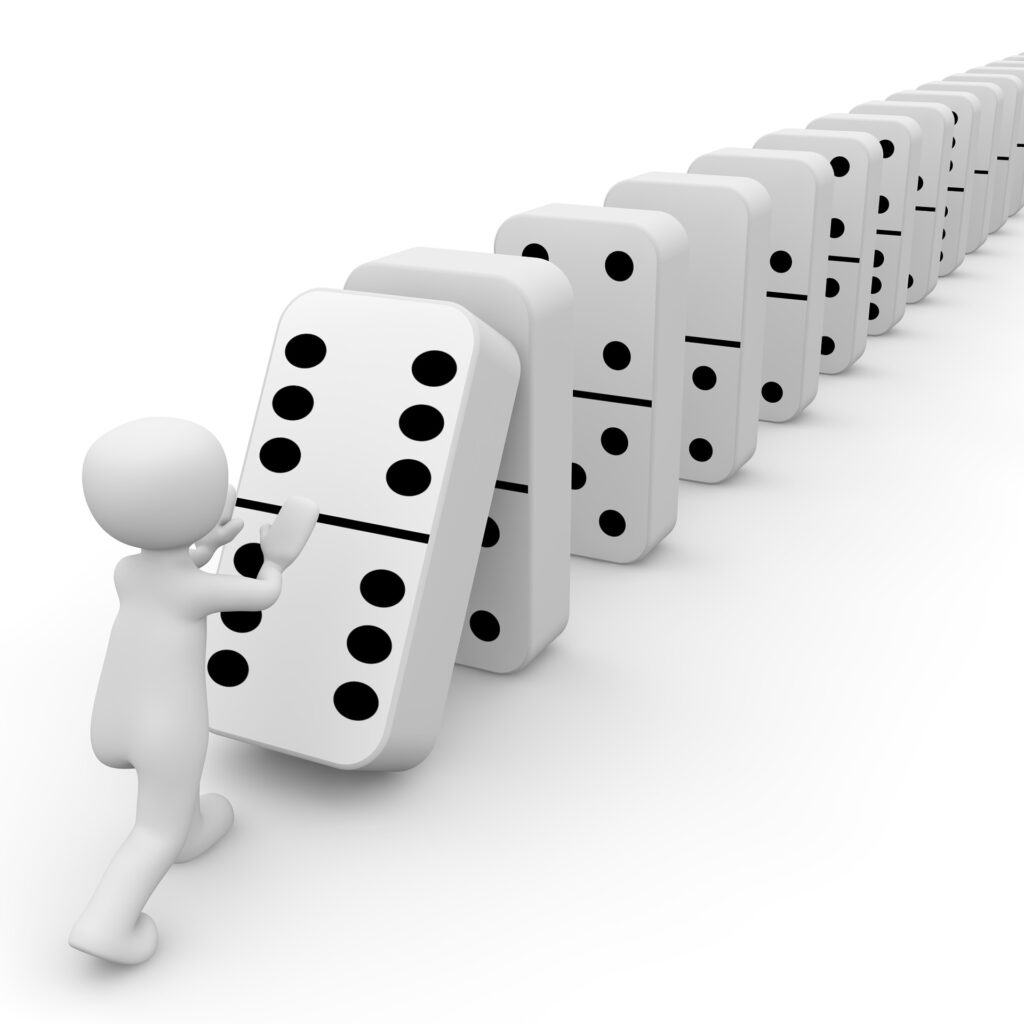 Image of a white clay person pushing the first in a long line of Dominoes over to start a chain reaction much like you can create compelling scenes with the MRU.