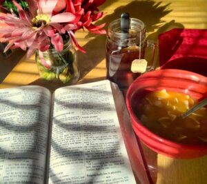 reading with lunch, flowers, and a cup of tea